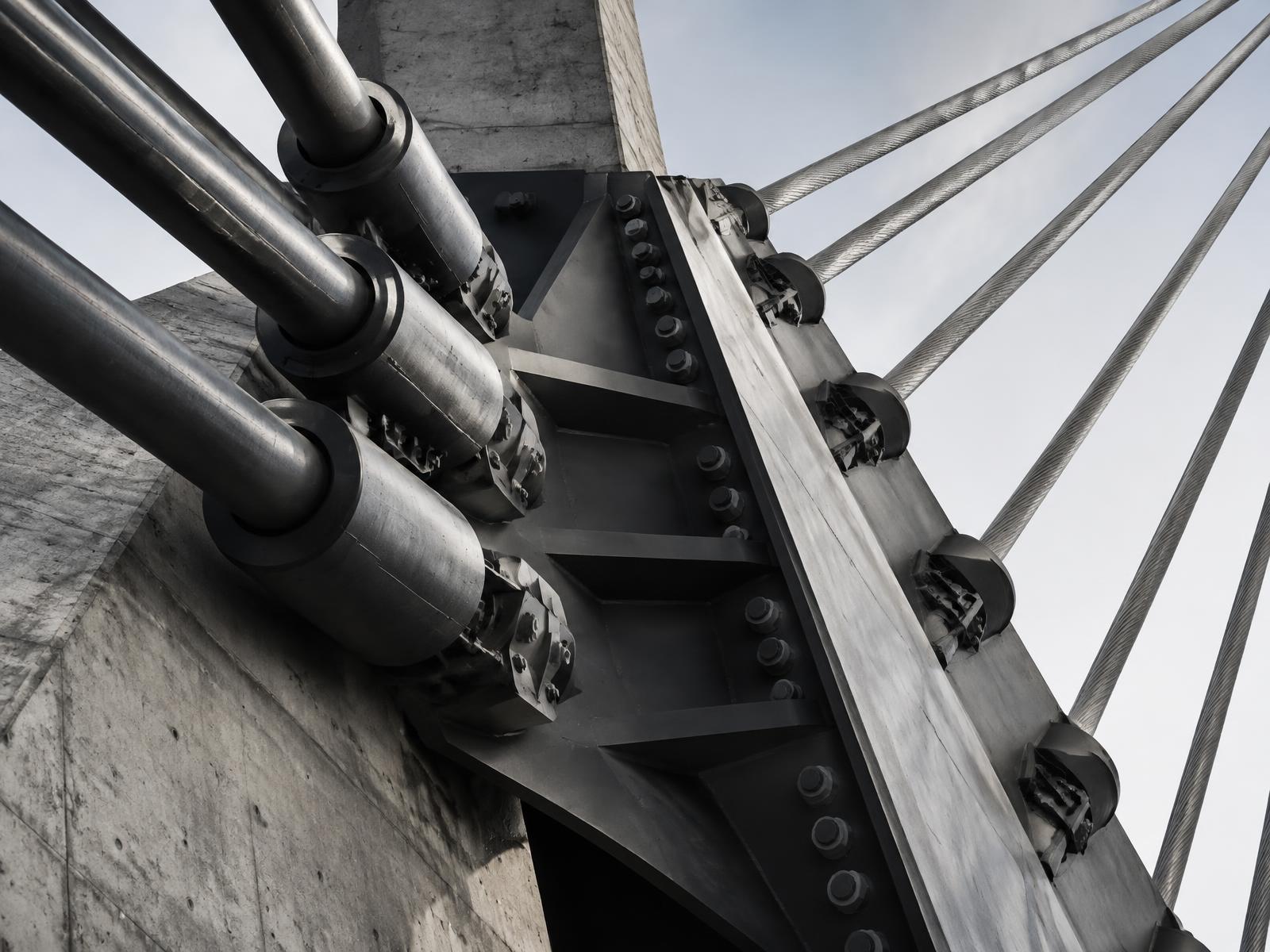 Steel cables meeting at an engineered structural joint